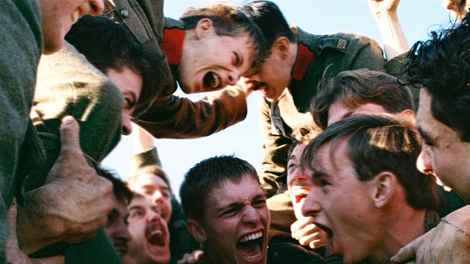 A group of men cheer at each other.